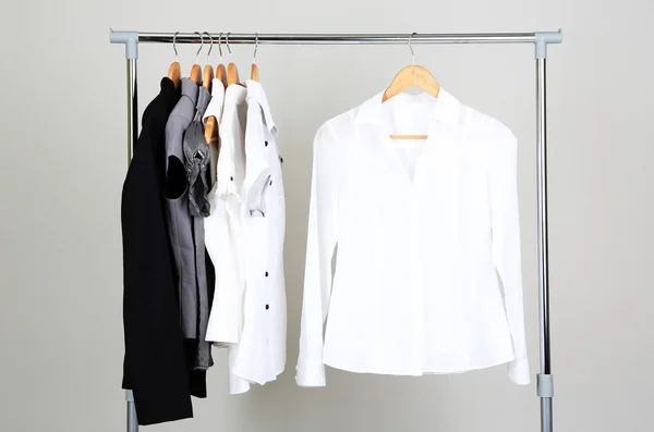 Office clothes on hangers, on gray background — Stock Photo, Image