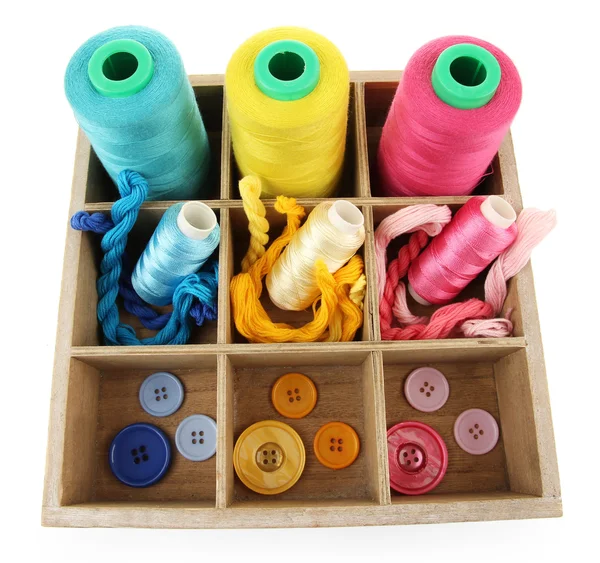 Multicolored skeins of thread and buttons in box isolated on white — Stock Photo, Image