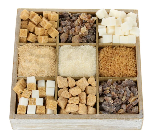 Verschillende soorten suiker in houten doos geïsoleerd op wit — Stockfoto
