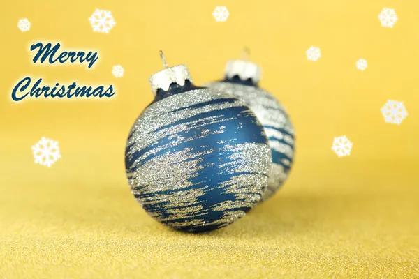 Christmas balls on yellow background — Stock Photo, Image