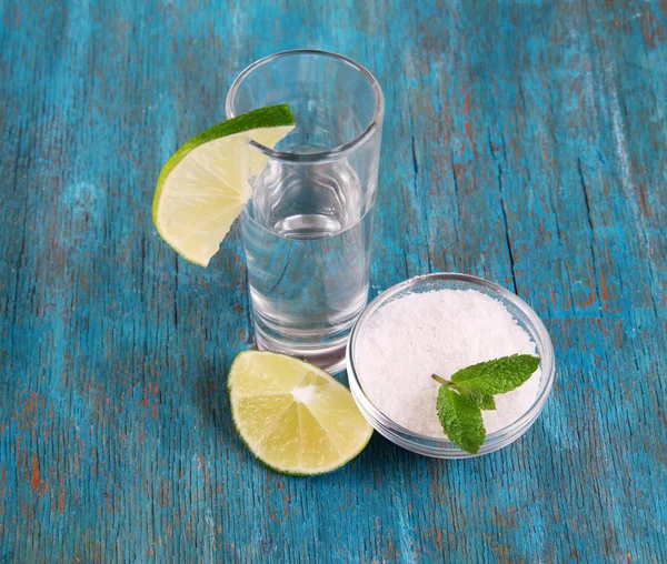 Tequila in glass on wooden table close-up — Stock Photo, Image