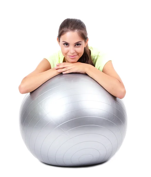 Young beautiful fitness girl with grey ball isolated on white — Stock Photo, Image