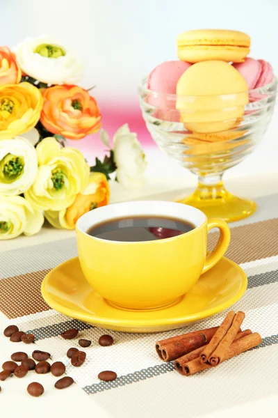 Coffee and macaroons on table on light background — Stock Photo, Image