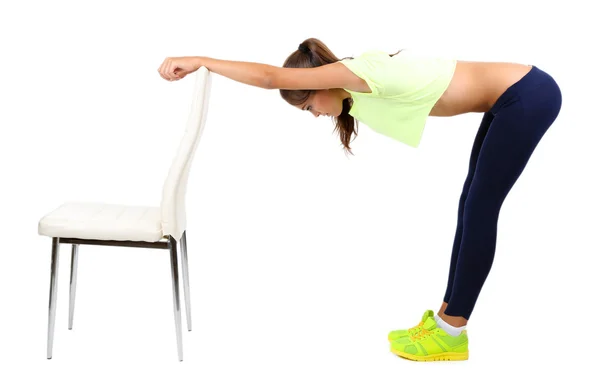 Menina bonita fazendo exercícios isolados no branco — Fotografia de Stock