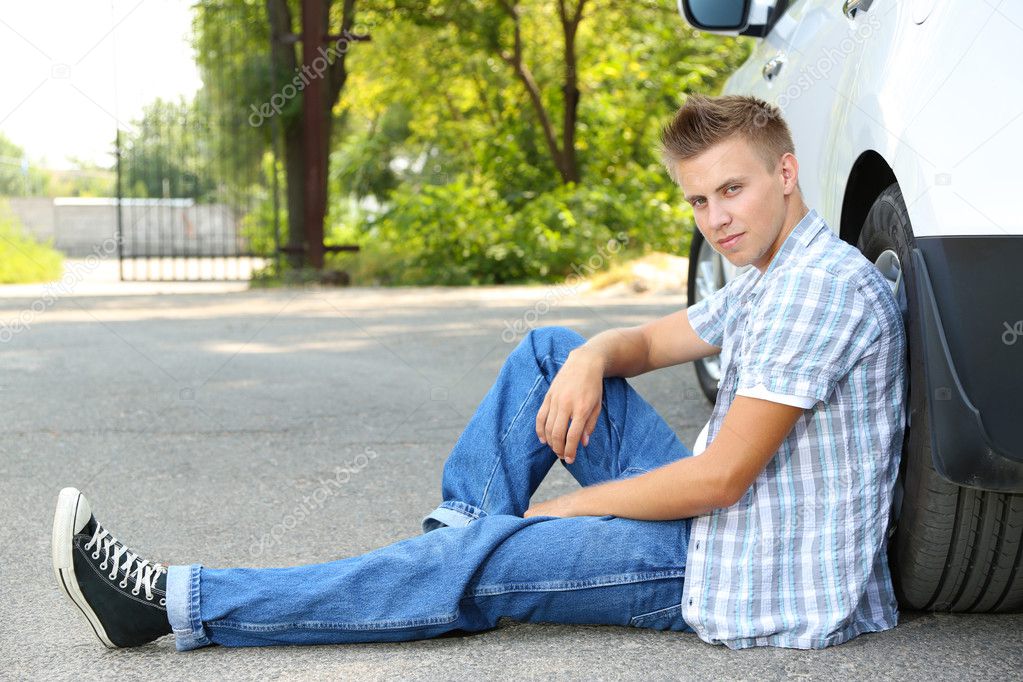 Man on the road with car breakdown waiting for rescue