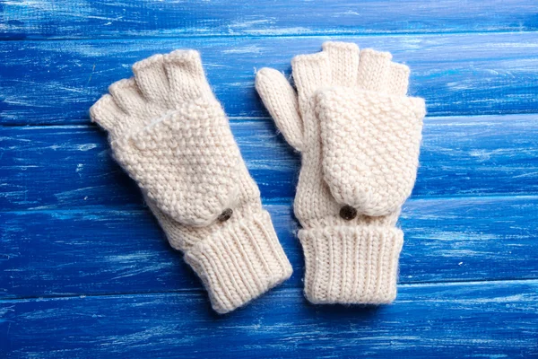 Wool fingerless gloves, on wooden background — Stock Photo, Image