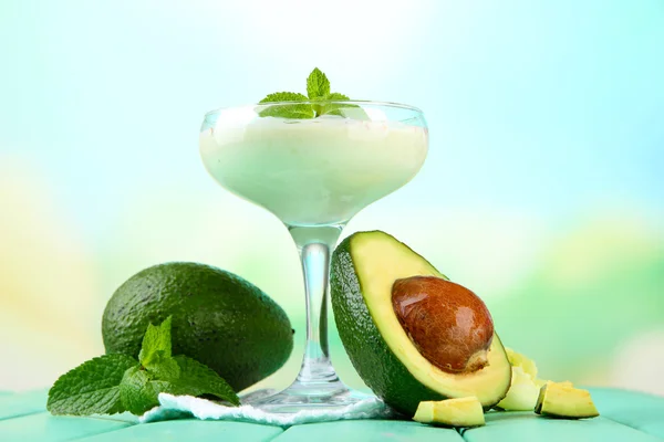 Fresh avocado smoothie on bright background — Stock Photo, Image