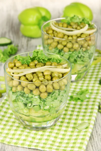 Tasty salad with fresh vegetables on wooden table — Stock Photo, Image