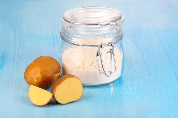 Starch in bank on wooden table close-up — Stock Photo, Image