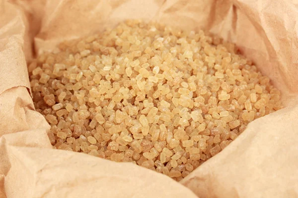 Brown sugar in paper close-up — Stock Photo, Image