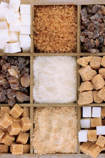 Different types of sugar in wooden box close-up — Stock Photo, Image