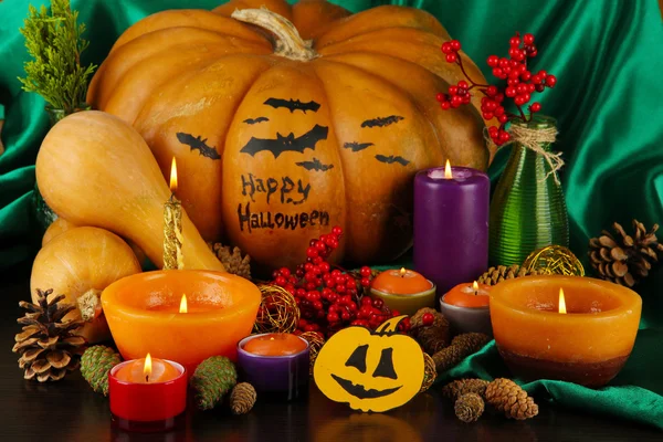 Composition for Halloween with pumpkins and candles close-up — Stock Photo, Image