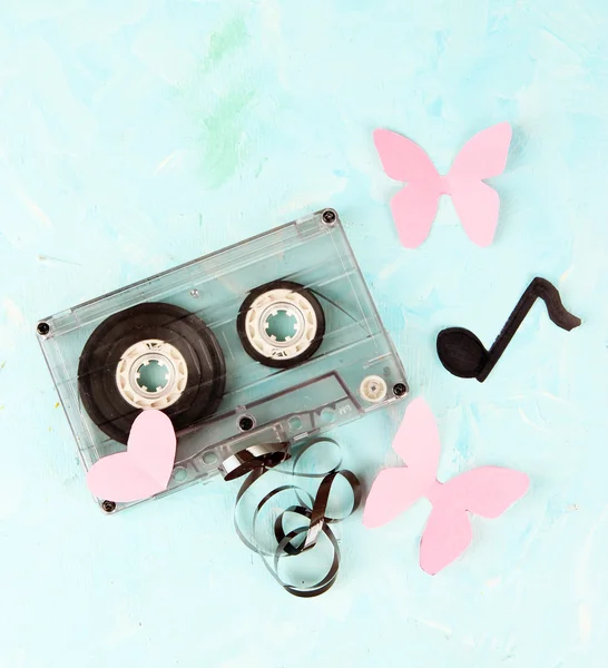 Old cassette on blue background — Stock Photo, Image