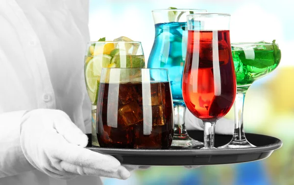 Waitresses holding tray with glasses of cocktails — Stock Photo, Image