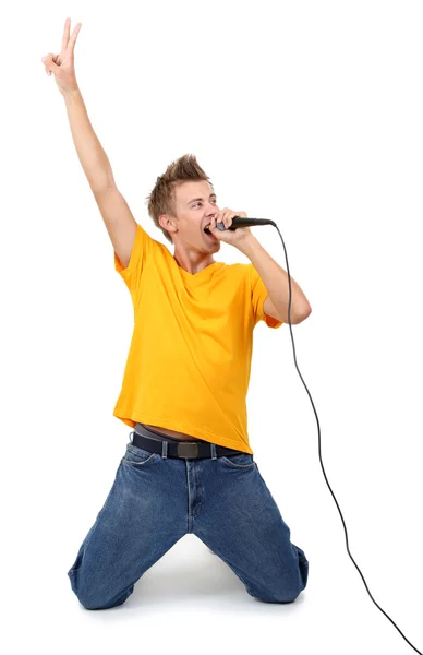 Knappe jonge man zingt geïsoleerd op wit — Stockfoto