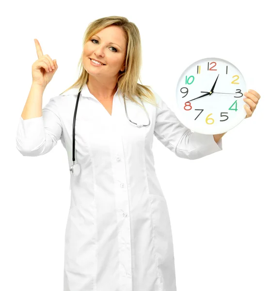 Young beautiful doctor with stethoscope and clock, isolated on white — Stock Photo, Image