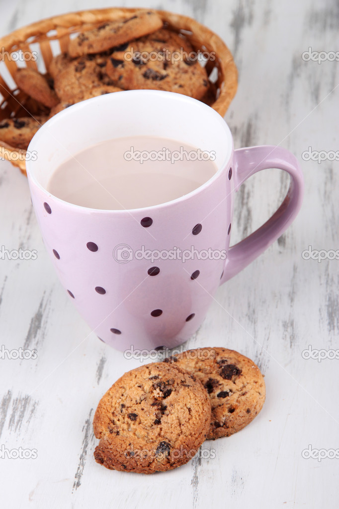 Cocoa drink and cookies on wooden background