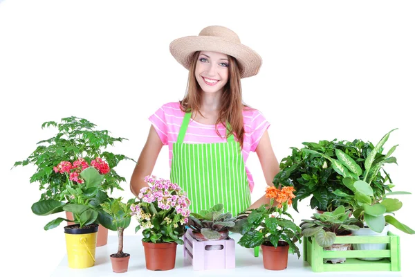 Beautiful girl gardener with flowers isolated on white — Stock Photo, Image