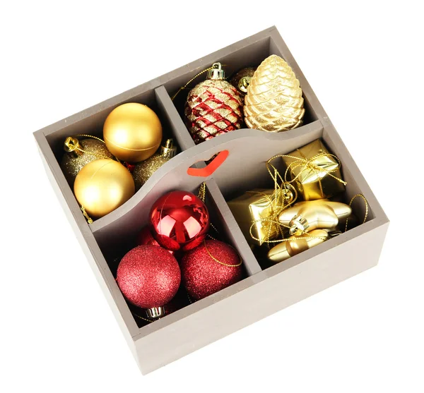 Wooden box filled with christmas decorations, isolated on white — Stock Photo, Image