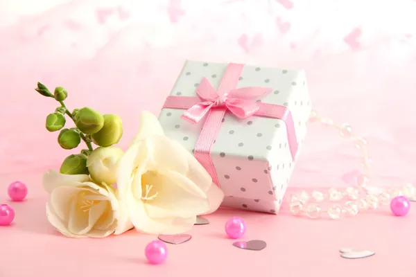 Beautiful romantic gift box and flower on pink background — Stock Photo, Image