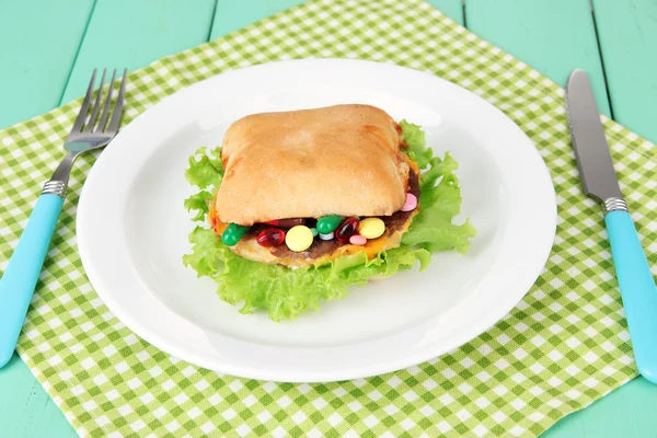 Conceptual image for nutritional care:assorted vitamins and nutritional supplements in bun. On wooden background — Stock Photo, Image