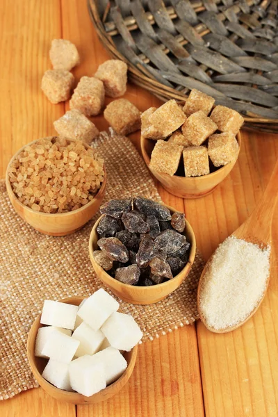 Different types of sugar on table close-up — Stok fotoğraf