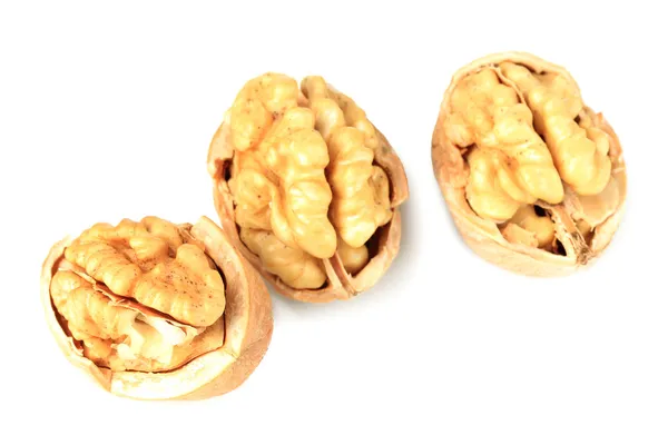 Broken walnuts isolated on white — Stock Photo, Image