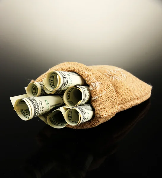 Money in bag on dark background — Stock Photo, Image