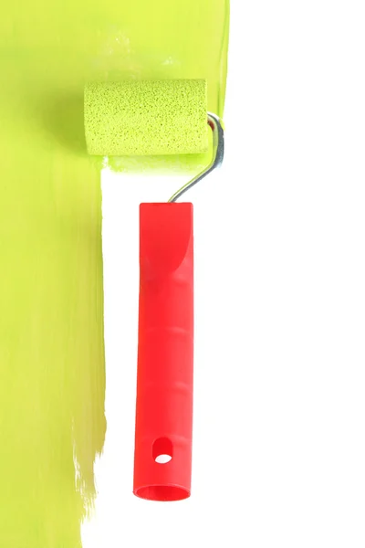 Roller brush with green paint closeup — Stock Photo, Image