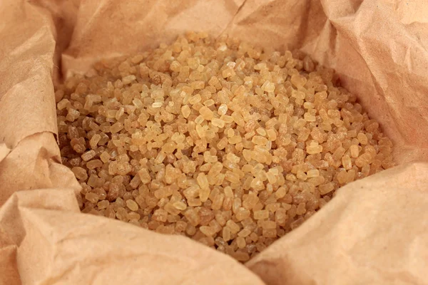 Brown sugar in paper close-up — Stock Photo, Image