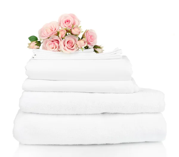 Stack of clean bedding sheets isolated on white — Stock Photo, Image