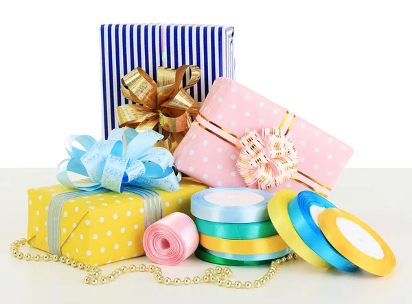 Tapes for wrapping gifts with holiday gifts isolated on white — Stock Photo, Image