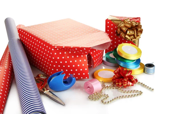 Materials and accessories for wrapping gifts with holiday gifts isolated on white — Stock Photo, Image