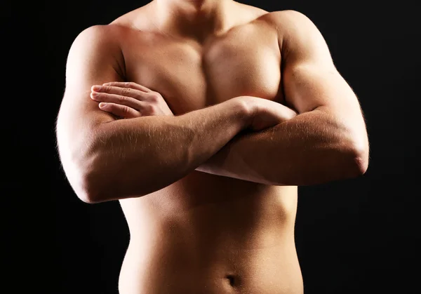 Handsome young muscular sportsman, on dark background — Stock Photo, Image