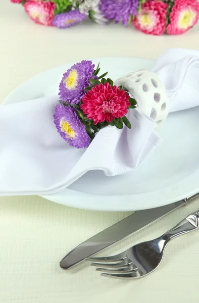 Festive dining table setting with flowers isolated on white — Stock Photo, Image