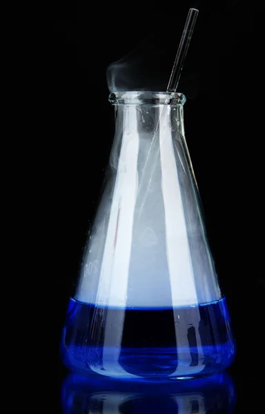 Laboratory beaker on black background — Stock Photo, Image