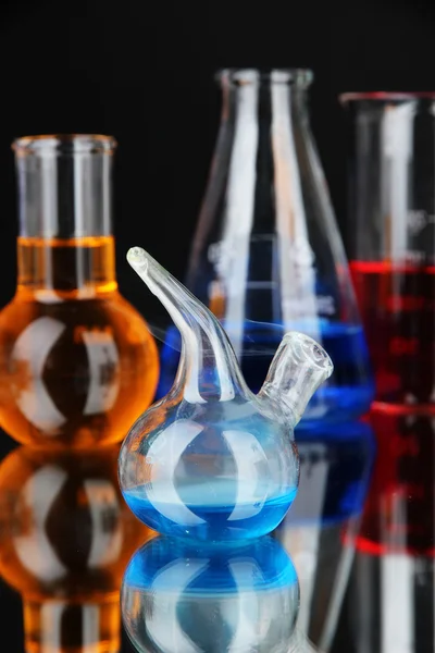 Laboratory glassware on black background — Stock Photo, Image