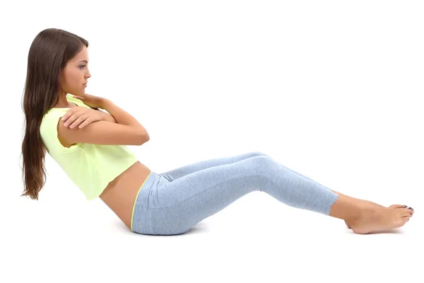 Jovem bela menina fitness fazendo exercício de ioga isolado no branco — Fotografia de Stock