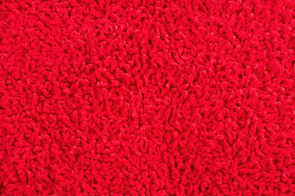 Fleecy red pillow close-up background — Stock Photo, Image