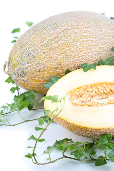 Ripe melons in leaves isolated on white — Stock Photo, Image