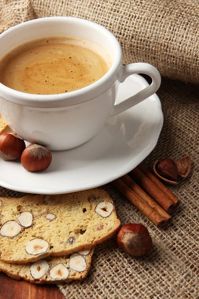 Cup of tasty coffee with Italian biscuit, on wooden background — Stock Photo, Image