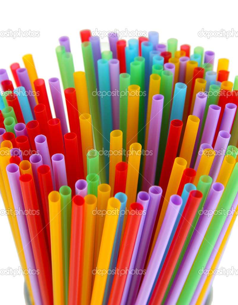 Many straws close-up isolated on white
