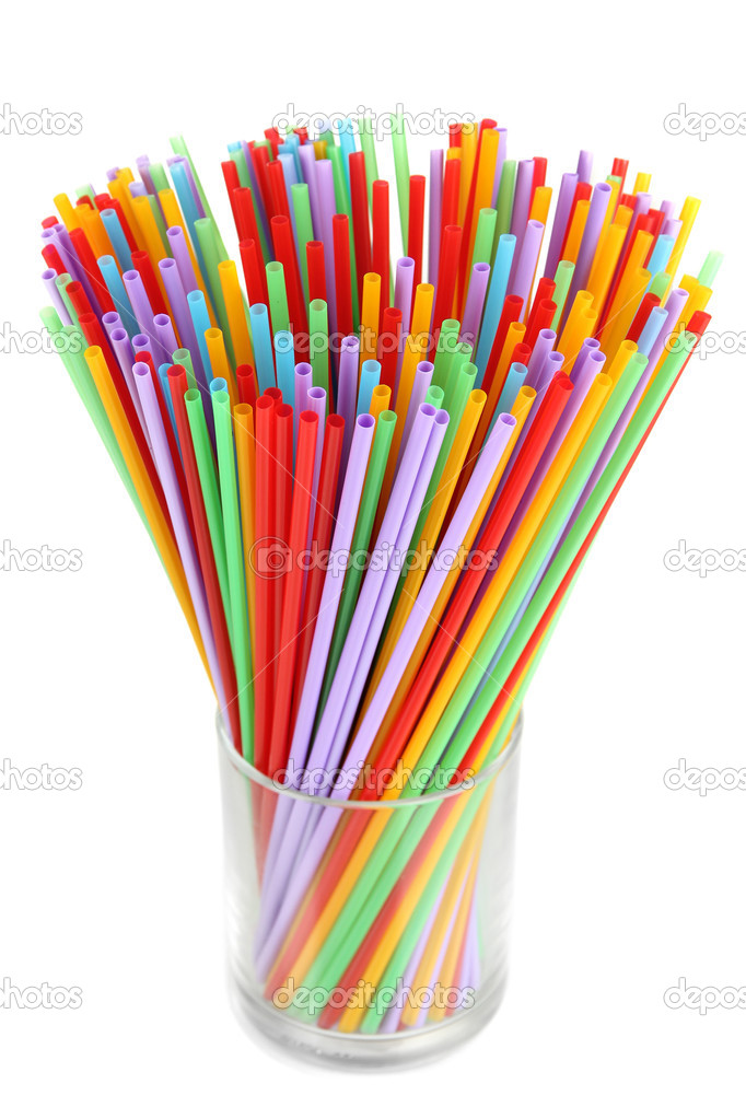 Many straws in glass isolated on white