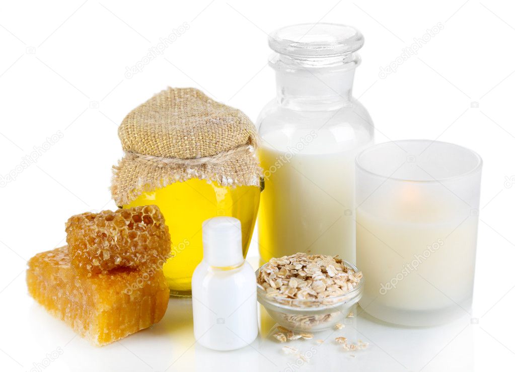 Honey and milk spa with oils and honey isolated on white