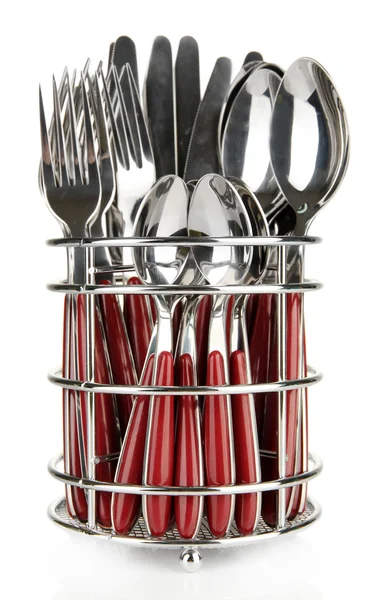Cuchillos, tenedores y cucharas en soporte metálico aislados en blanco — Foto de Stock
