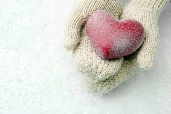 Female hands in mittens with red heart, close-up — Stock Photo, Image