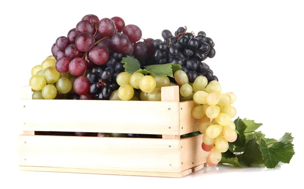 Assortment of ripe sweet grapes in wooden crate, isolated on whit — Stock Photo, Image