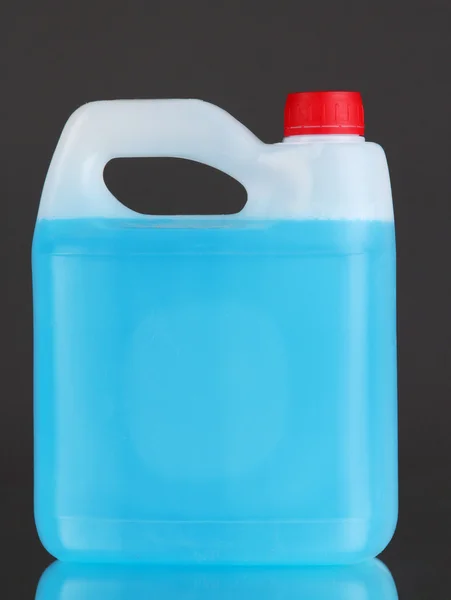 Blue liquid for car in canister on grey background — Stock Photo, Image