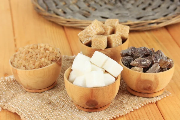 Different types of sugar in bowls on table close-up — Stock Photo, Image