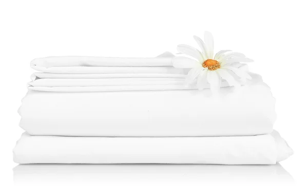 Stack of clean bedding sheets isolated on white — Stock Photo, Image